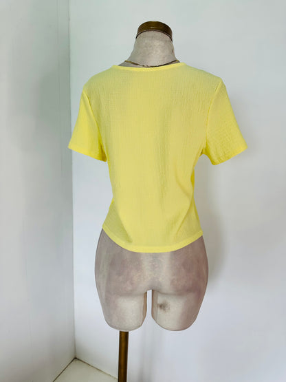 Blusa amarilla lazos
